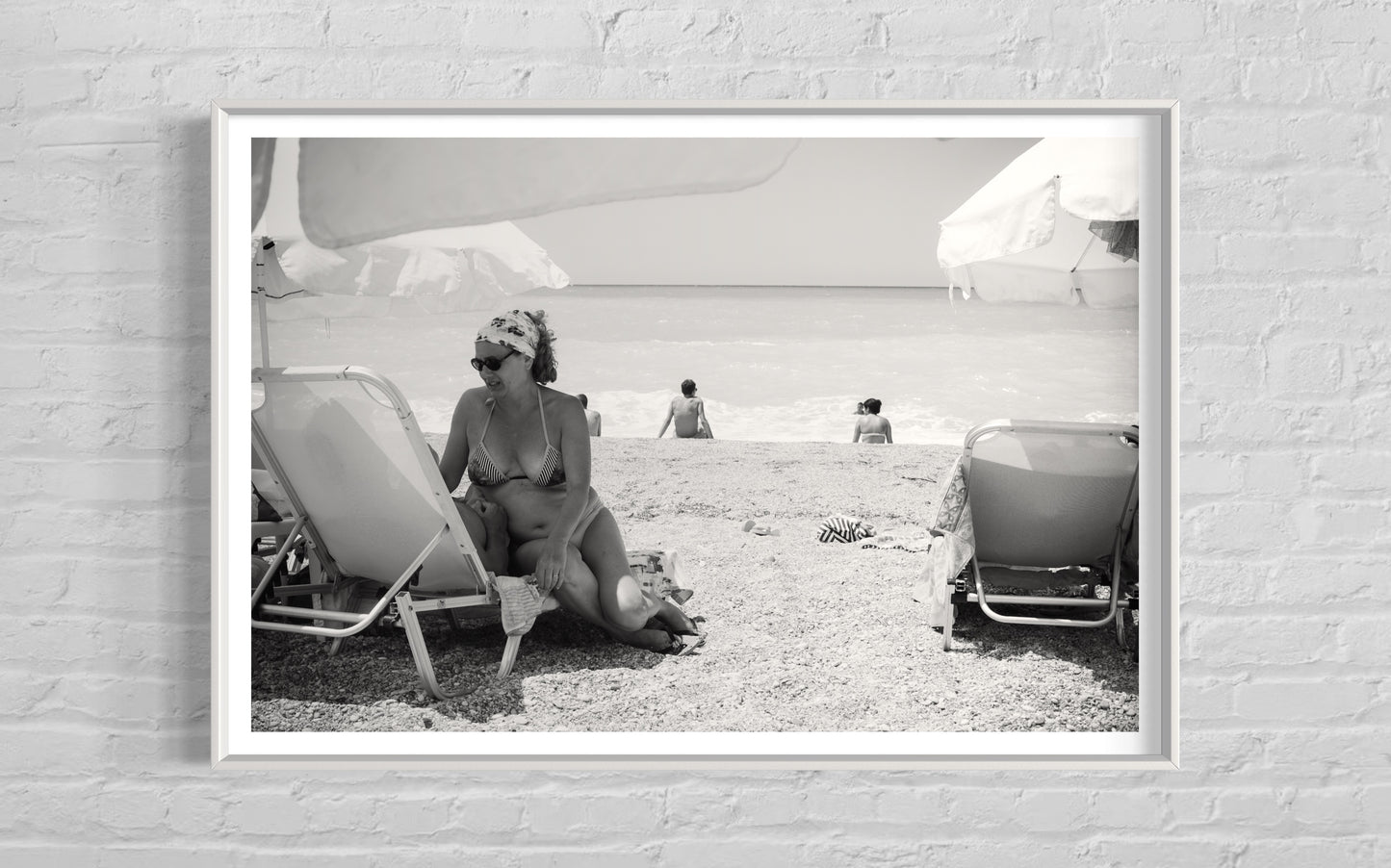 A beautiful woman talking to her husband in Port Katsiki, Lefkada, Greece.